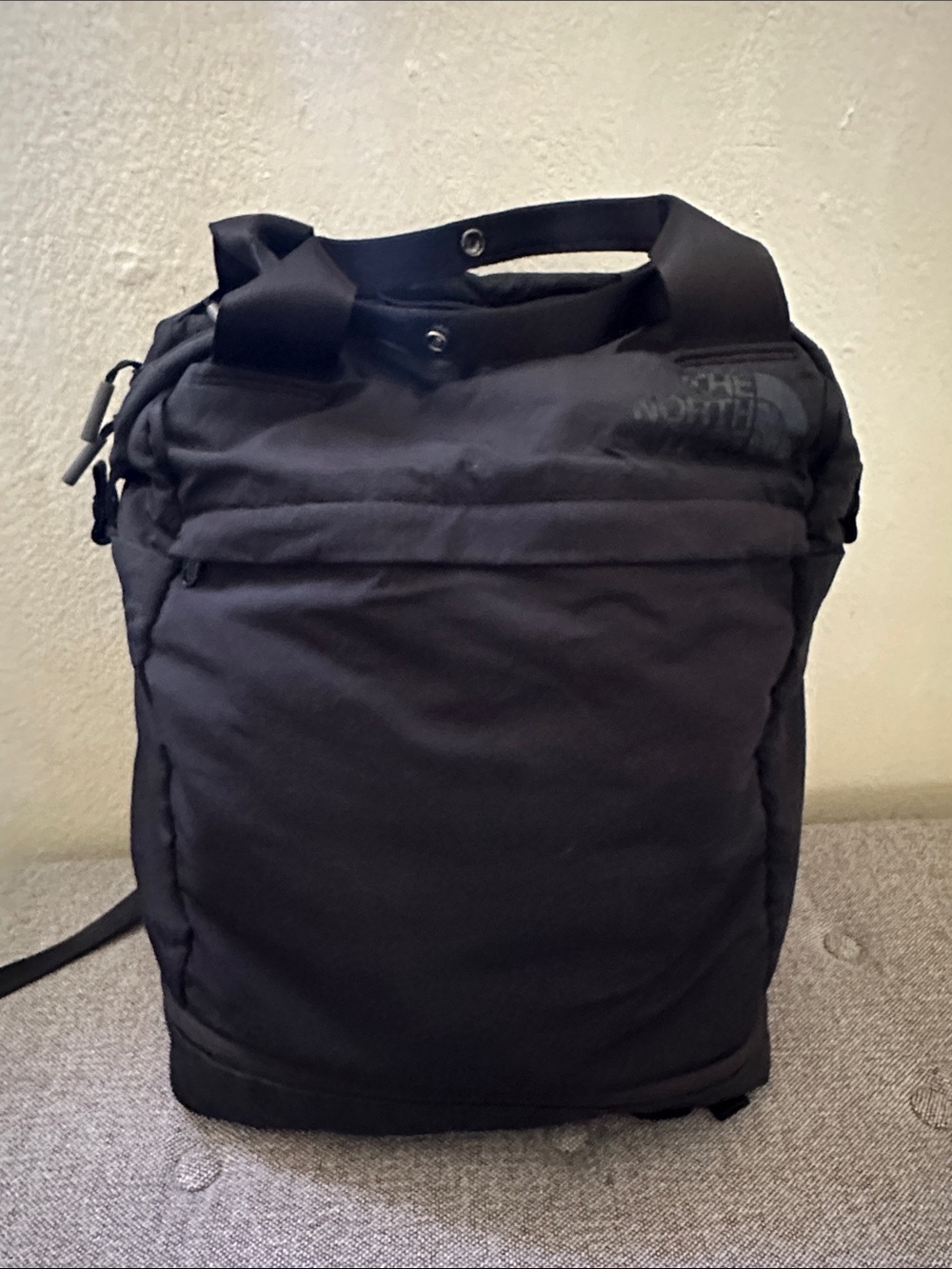 Black Backpack - The North Face with shoe compartment.